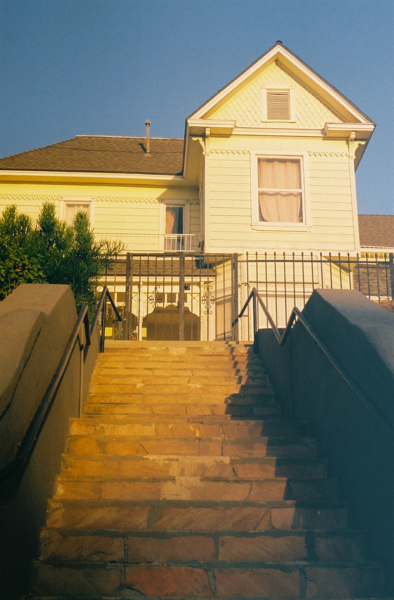 A Victorian style house that's been converted into apartments with views of the DTLA skyline.
