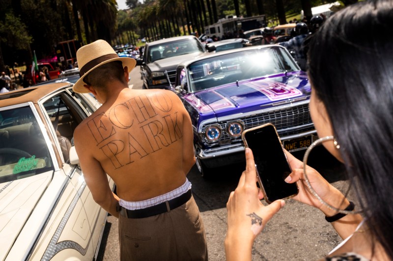 A man shows his "Echo Park" back tattoo.