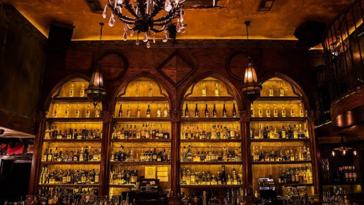 A beautiful backlit bar reminsicient of Havana at La Descarga.