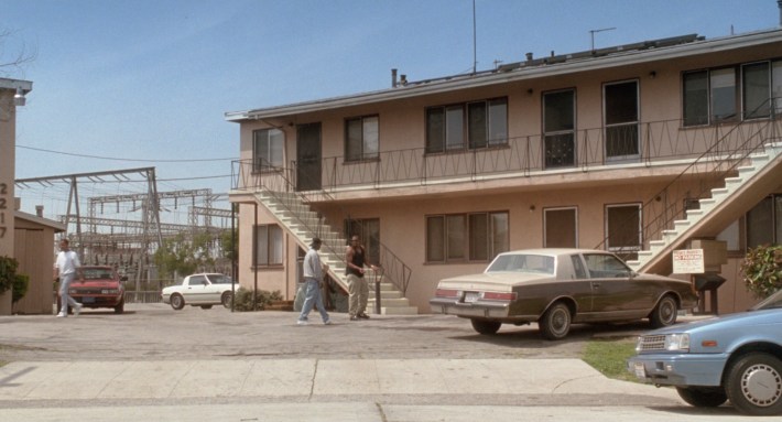 Lucky and J-Bone walk to Angel’s apartment building. Screenshot via Columbia Pictures.