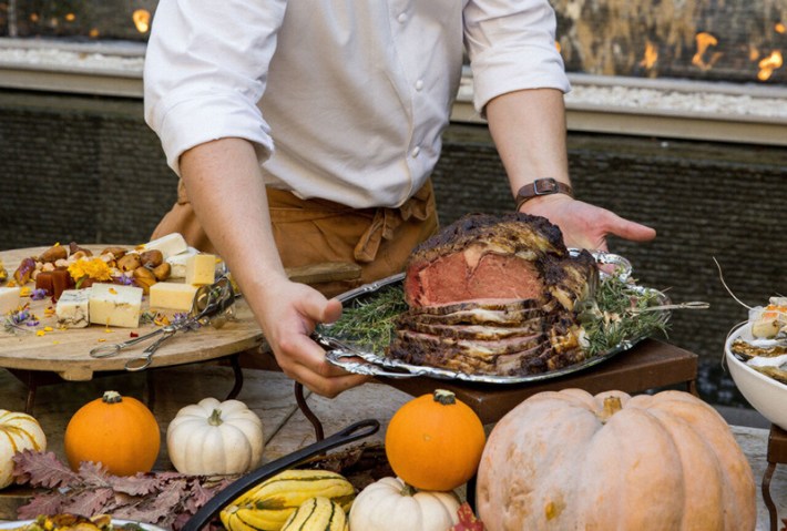 A chef setting out a roast at the Sunday brunch buffet at 4 Seasons Hotel Los Angeles at Beverly Hills
