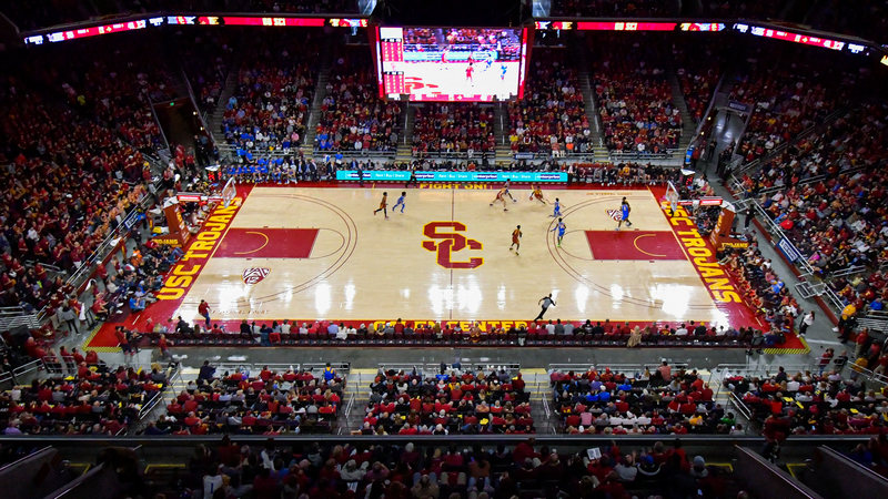 Overview shot of the USC men's basketball team playing competitors on the court at the Galen Center at USC