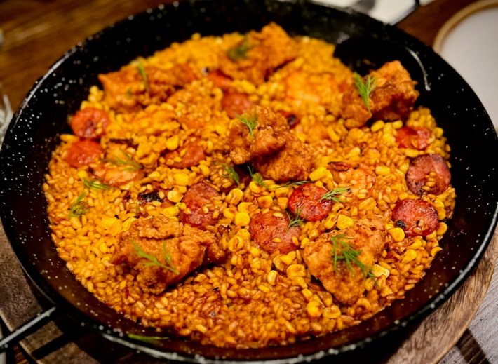 A paella with fried chicken and chorizo from a collaboration of Hotville Chicken and Gasolina Cafe