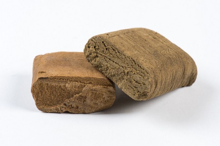 Two bars of golden-colored hashish