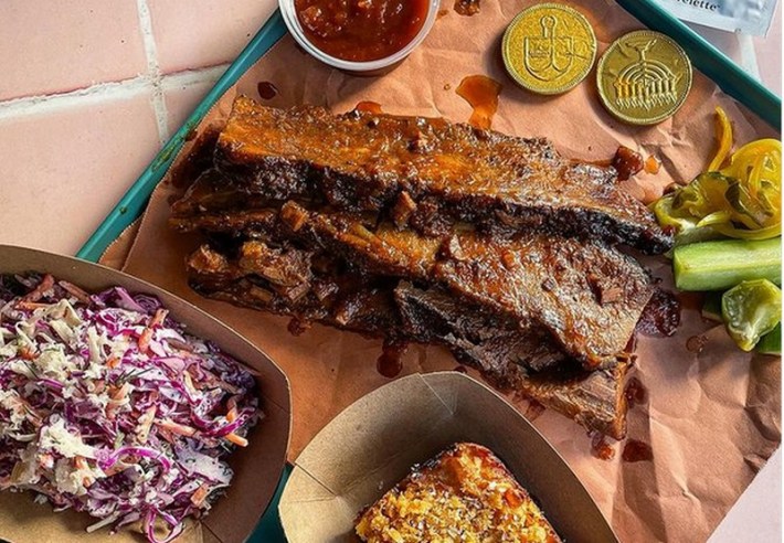 Brisket and geld chocolates on brown paper, some of the offerings at Festivus in West LA