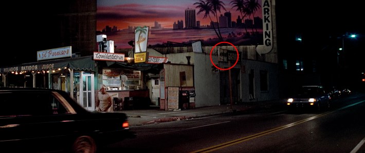 A sign for George’s Garage is seen next door to El Paraiso Screenshot via Universal Pictures
