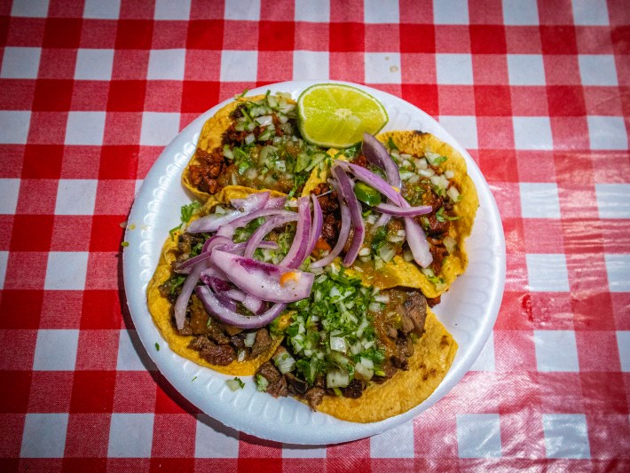 A quartet of tacos with pickled onions at Angel's Tijuana Tacos in Los Angeles