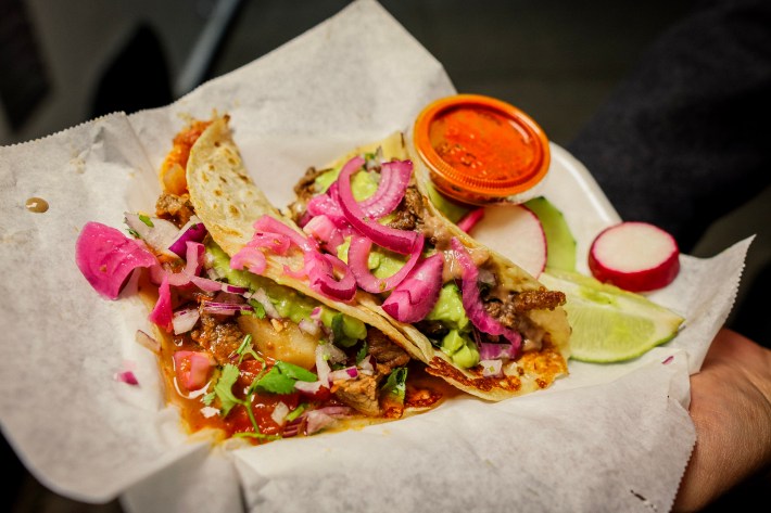Two tacos at El Ruso with salsa, radish, and lime