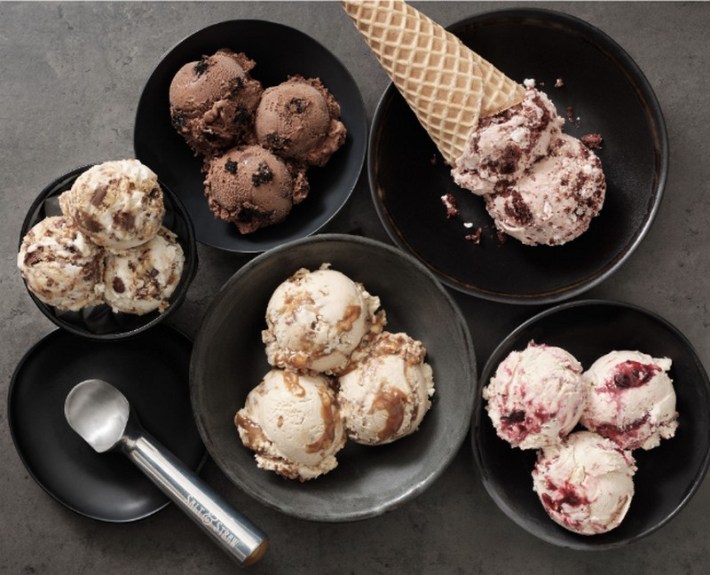 Various scoops of ice cream in bowls and one in a waffle cone from Salt & Straw