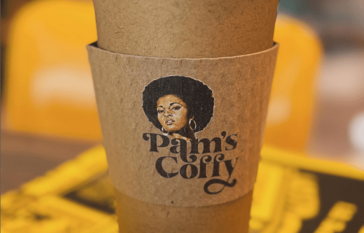 A coffee cup with Pam Grier's 1970-era face on the band