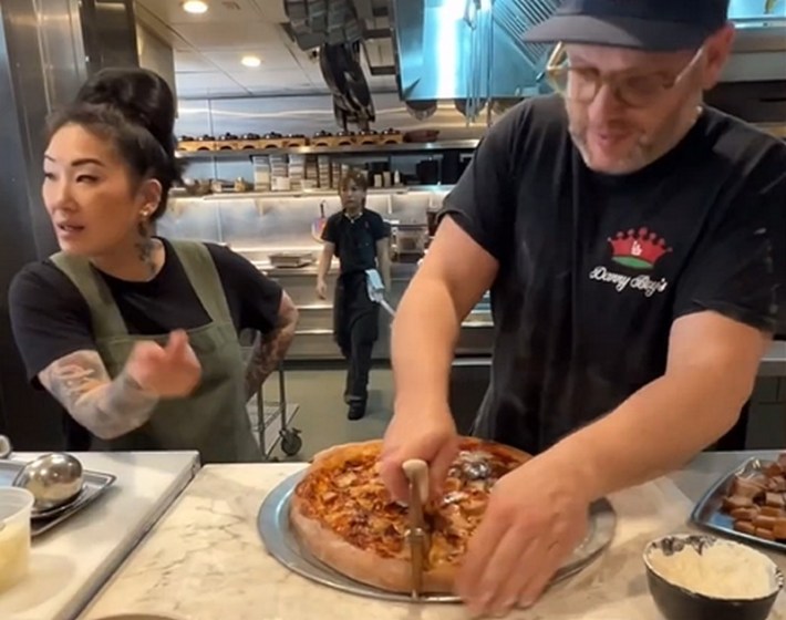 Chefs Katianna Hong and Daniel Holzman making pizza together