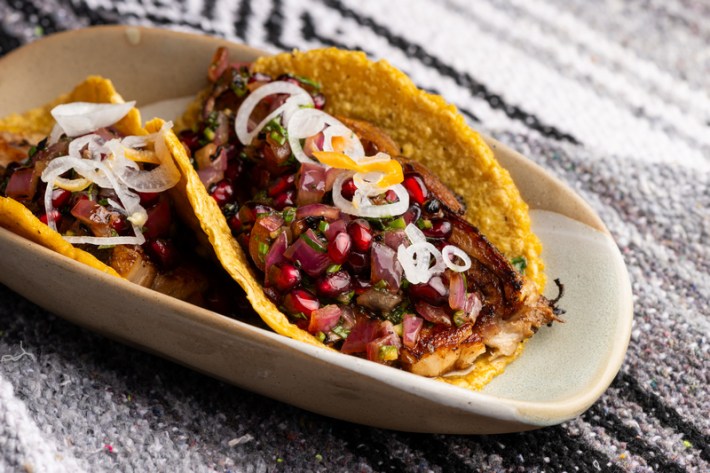 A yellow tortilla with pork belly and pomegranate from Hollywood's Ka'teen