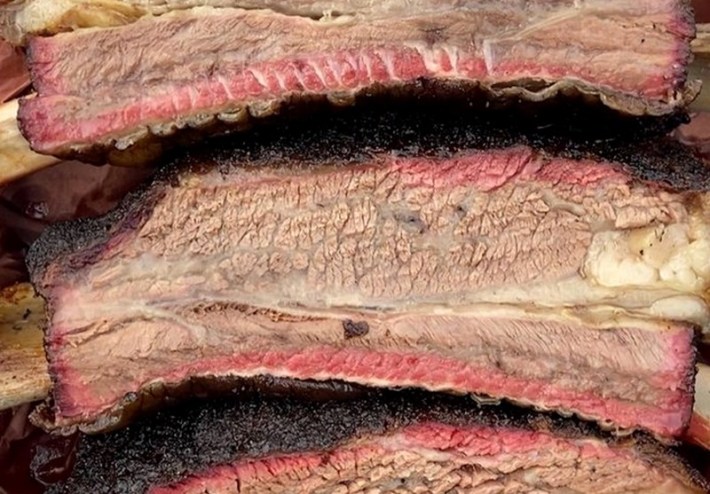 Beef ribs stacked upat Paceco's BBQ in Atla Den