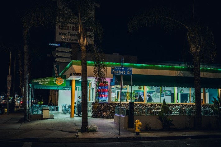 An exterior view of Tacos Baja in Whittier, California, at night