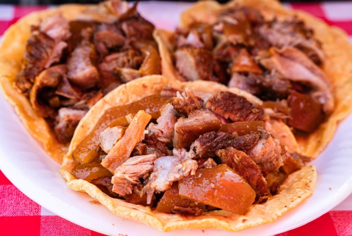 The tacos at Carnitas Los Gabrieles are loaded and stacked with meat.