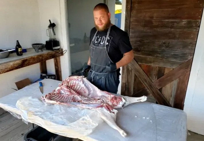 An Argentine chef preparing a whole lamb