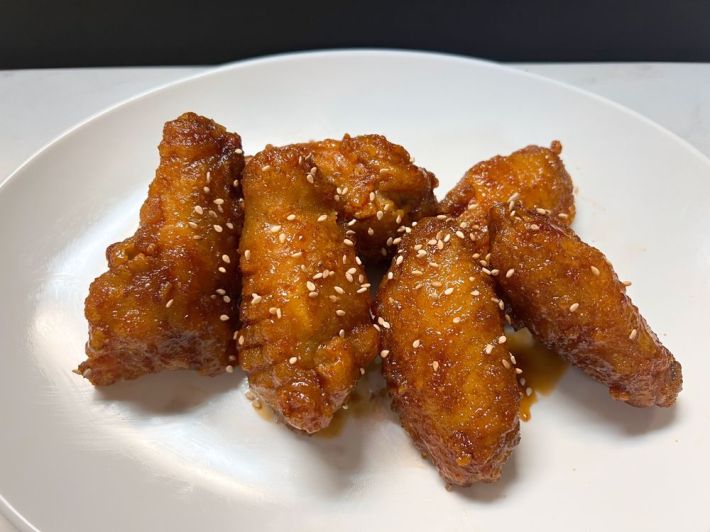 Four glazed Korean fried chicken wings