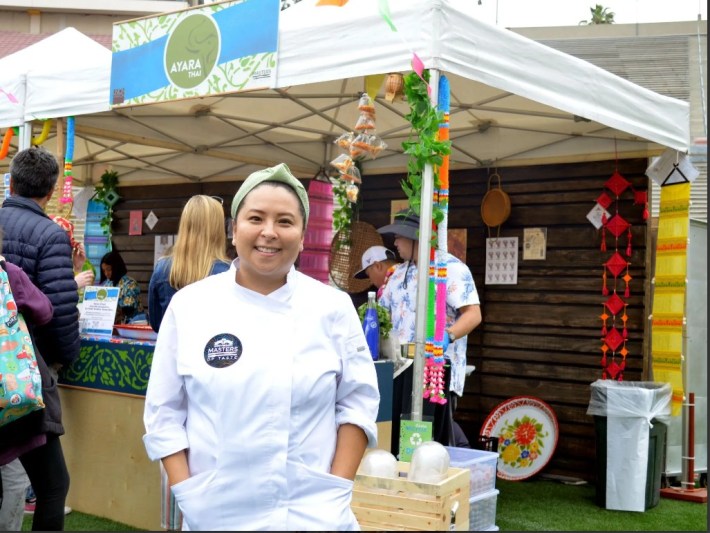 Vanda Asapahu of Ayara Thai, standing in front of the restaurant's tent at Masters of Taste