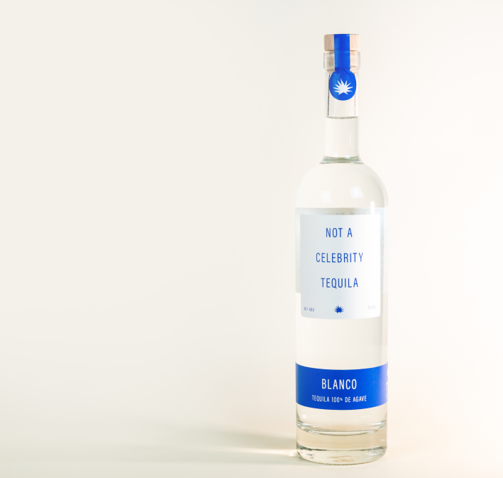 An upright bottle of Not a Celebrity Tequila on a white background