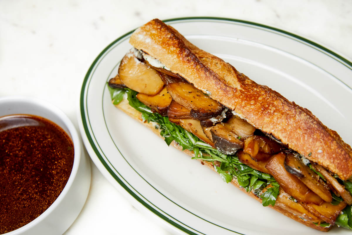 A French Dip sandwich made with king oyster mushrooms