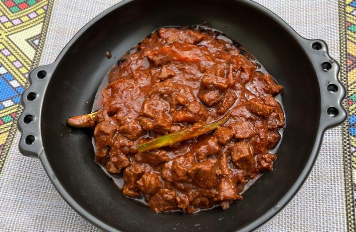 Ethiopian Awaze beef tibs in a cast-iron bowl