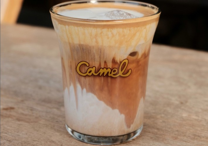 A milky coffee in a glass