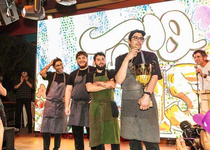 Chef Chuy Cervantes and his Ditroit team on stage accepting their win.