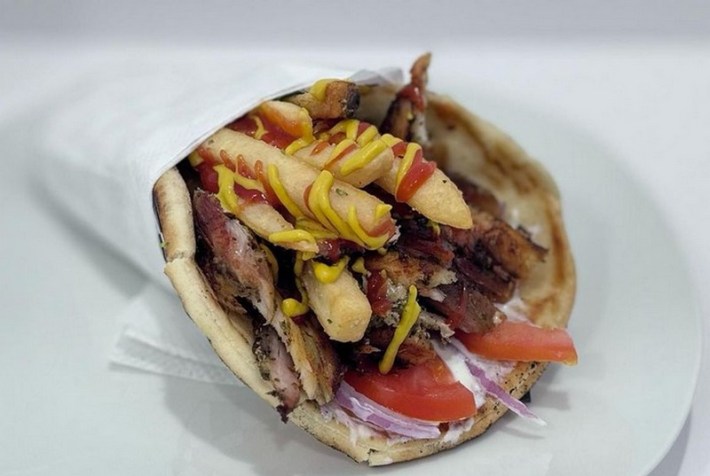 A pork gyro stuffed with fries.