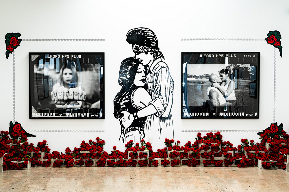 A wall showing photos by Estevan Oriol bookending an image from Teen Angel of a girl and boy embracing