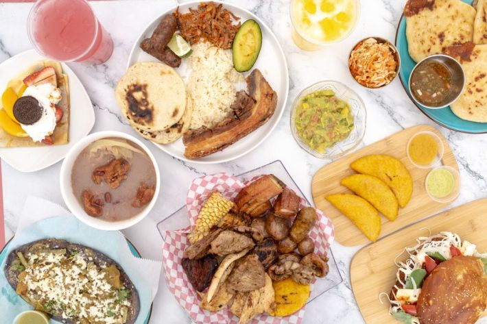 Bandeja paisa, arepas, empanadas, fritanga, and other dishes at Colombia Parce.