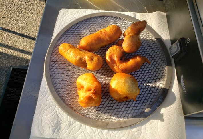 Golden fish, shrimp, and lobster straight out of the deep fryer.