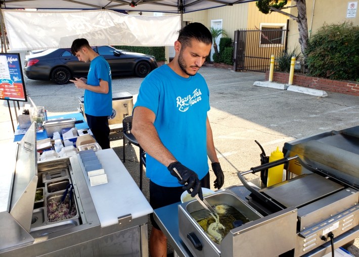 The chef frying fish, shrimp, and lobster at Razos Fish Tacos.