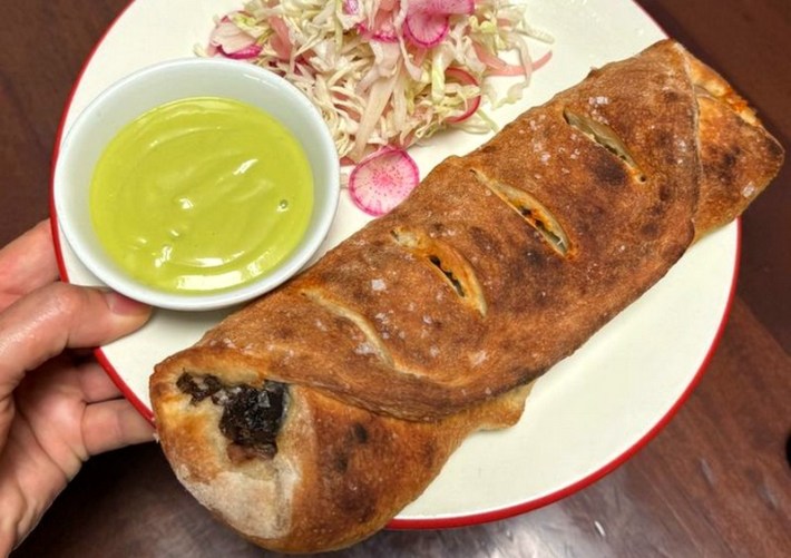 Cabeza stromboli from Sonoratown, with side of salsa aguacate