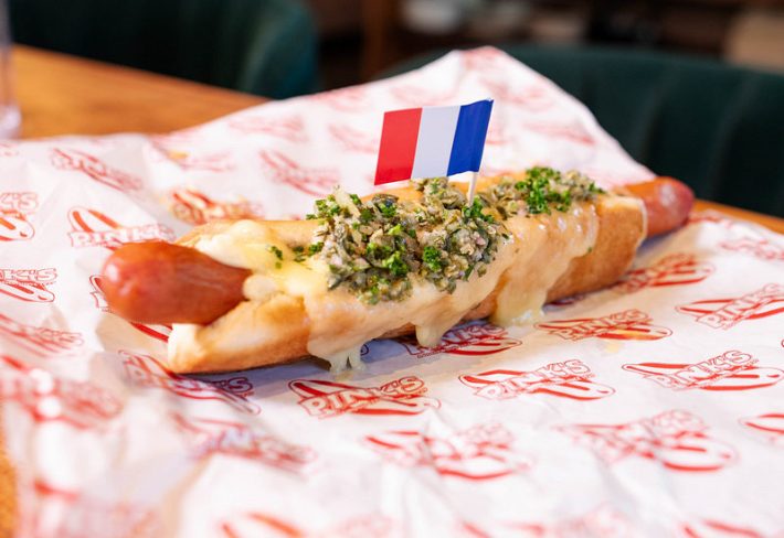 The Champs Elysee hot dog with raclette cheese and a white wine shallot reduction from Mr. T and Pink's.