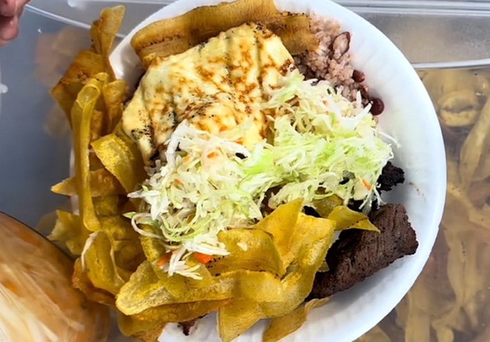 Beef and chicken with plantains chips and rice