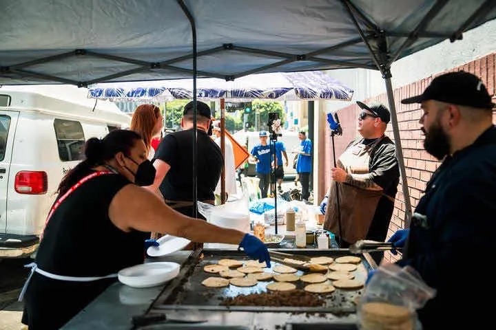 Street vendors preparing tacos on Skid Row. Photo courtesy of @altered_state_media23/Instagram