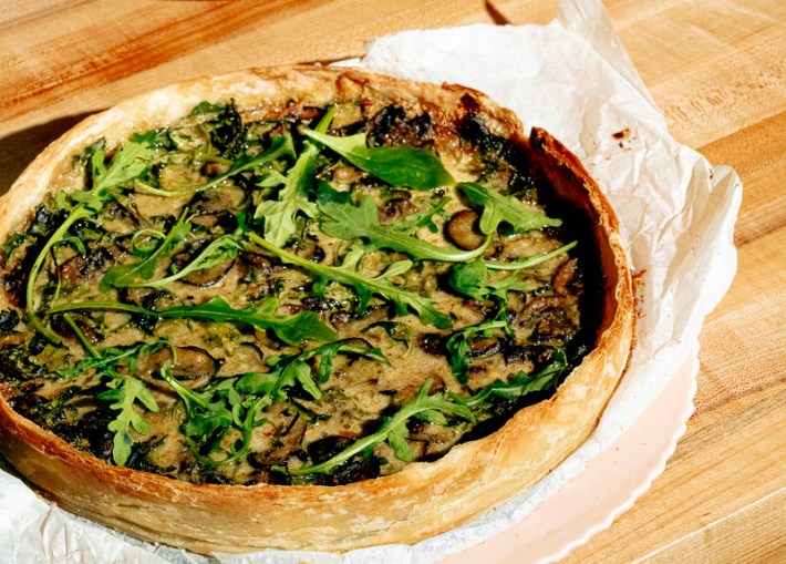 Garden quiche with Parmesan, mushroom, and arugula at Piknik.