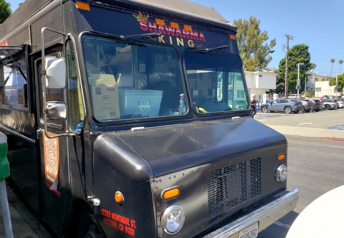 The black Marlen's Kitchen truck, with Shawarma King's logo