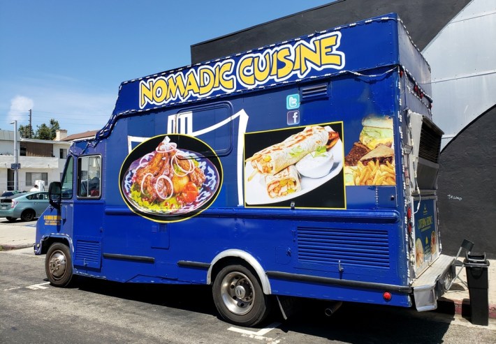 A blue food truck serving Central Asian food