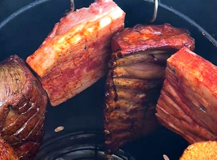 Barrel-smoked ribs, steak, and chicharron at Asados To Go