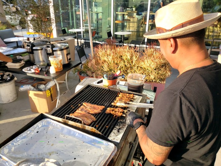 Owner Sam Oum, working on a hot grill at Kreung Kitchen