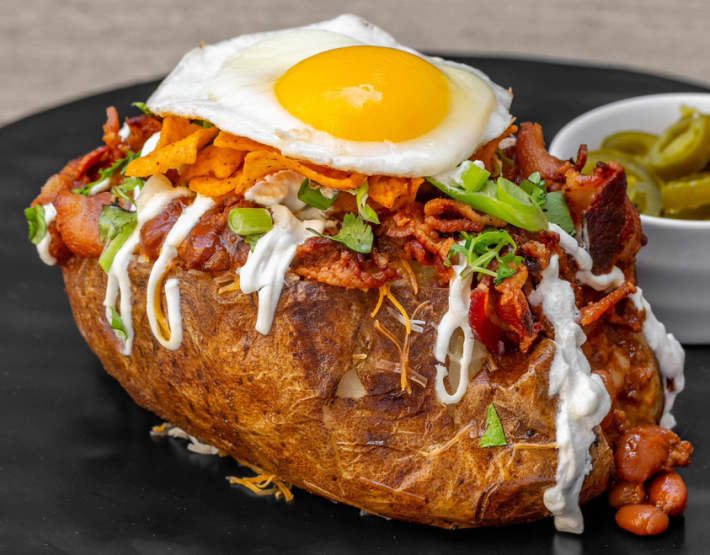 A chili-and-egg-topped baked potato