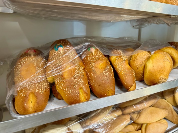 Pan de muerto on the racks at La Yalalag Bakery.