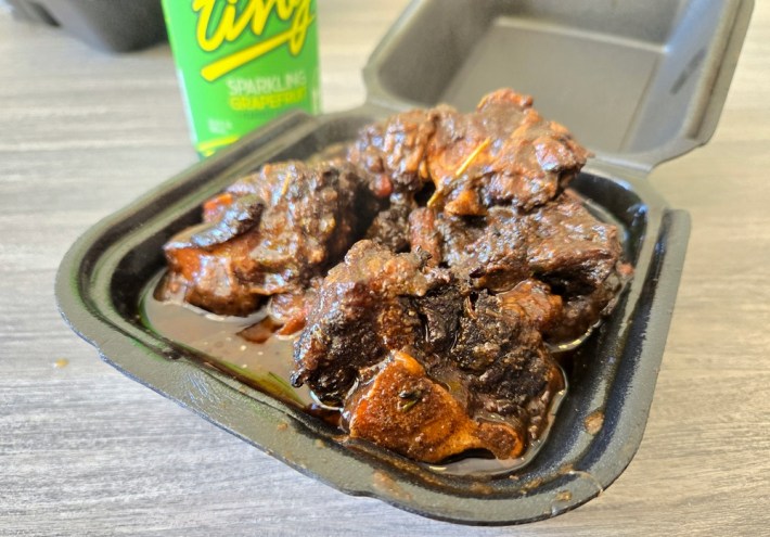 A container of Jamaican oxtails