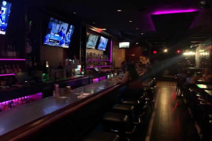 The Office, a dark bar lit with LEDs, in Lincoln Heights