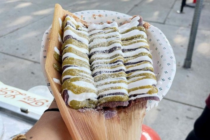 Three sauce-covered "Sesy's Beloved" tamales with pork carnitas at Tamales Olmeca.