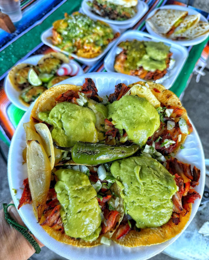 A plate of Angel's Tijuana Tacos de al pastor with guacamole.
