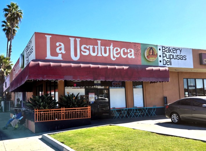 A red-trimmed building that serves as a Salvadoran bakery in L.A.