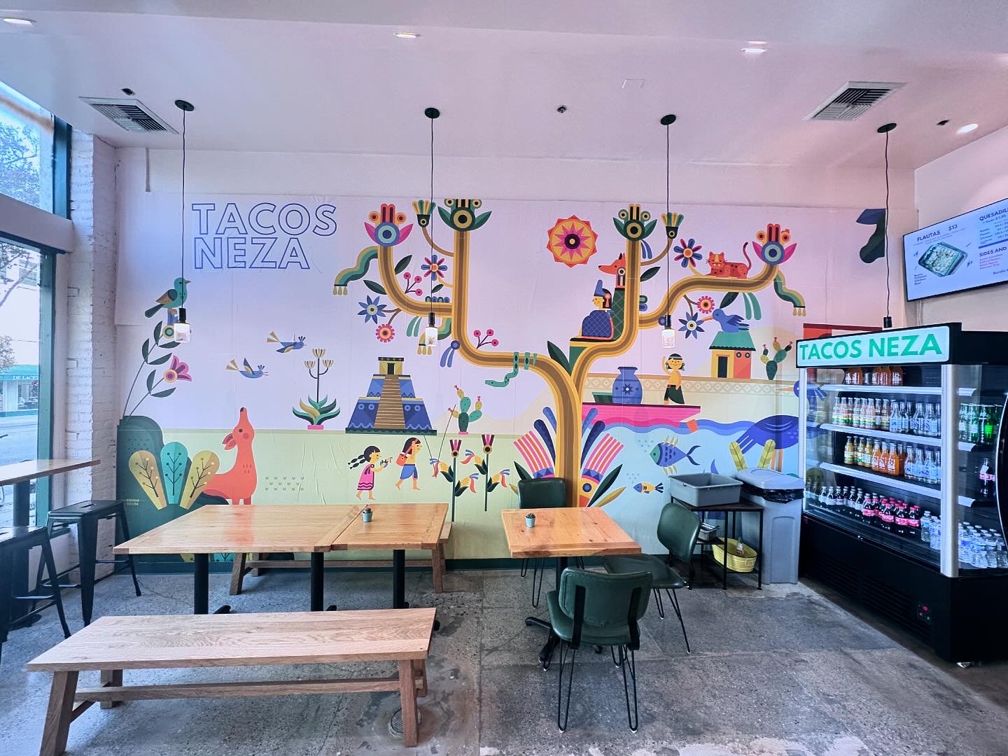 A colorful mural inside of Tacos Neza in Pasadena