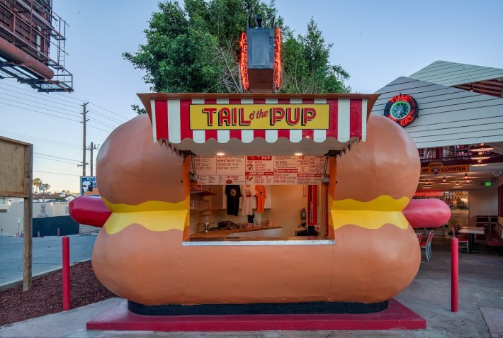The outside of Tail O' The Pup restaurant which is shaped like a giant hot dog.
